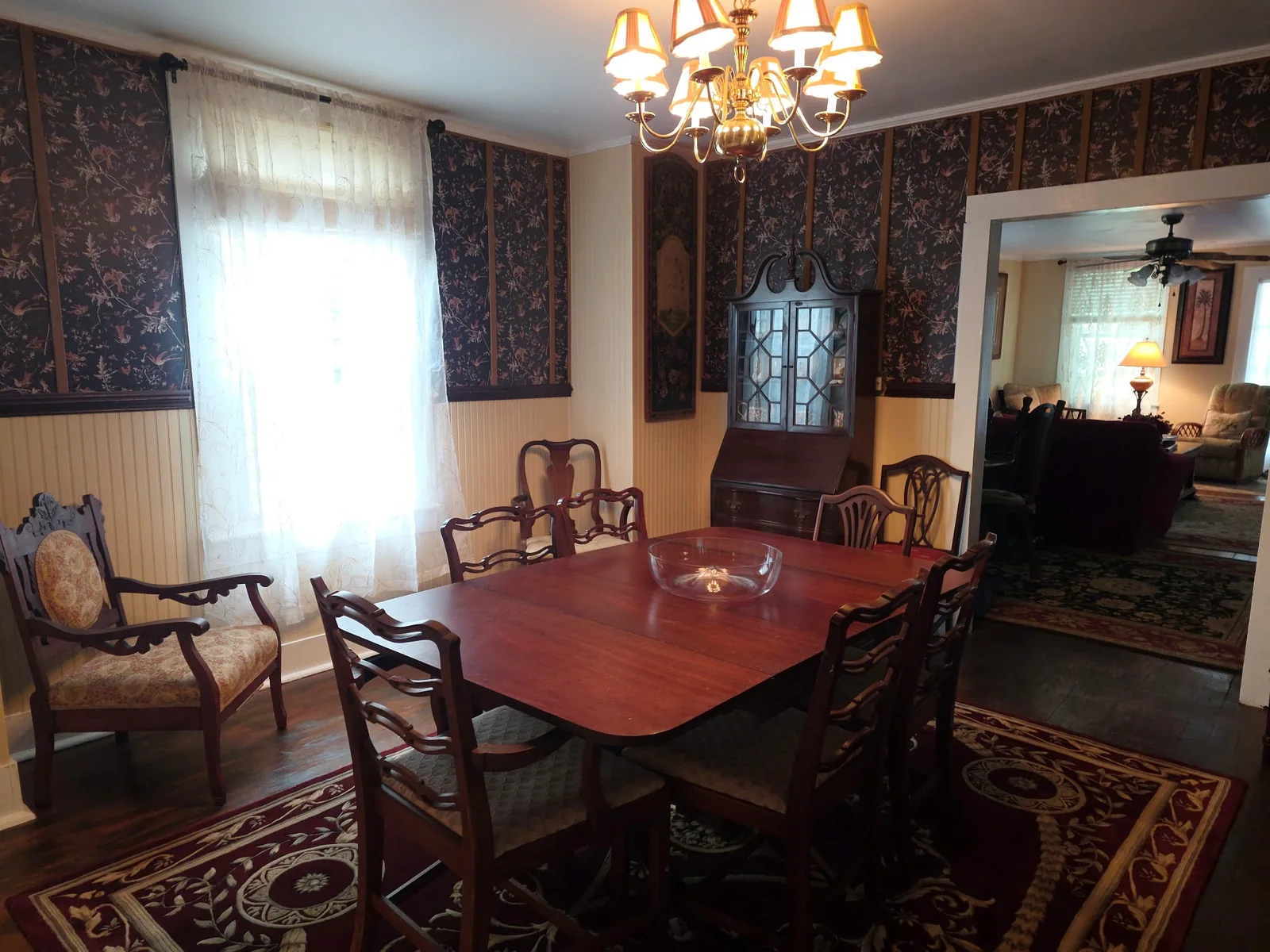 Traditional dining room with antique furniture inside The Byrd's Nest